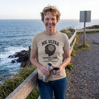 Amelia Earhart wearing the MK Ultra Summer Camp t-shirt in sand