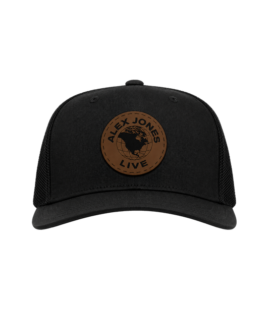 The Alex Jones Store - Black trucker hat with brown leather circle patch featuring 'Alex Jones Live' globe logo, front view