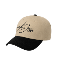 The Alex Jones Store - Side view of tan crown black brim Alex Jones Live Signature Trucker Hat with signature-style embroidered logo