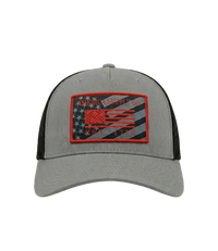 The Alex Jones Store - Front view of grey America Supply Co patch trucker hat with red-bordered American flag Est. 1776 woven patch