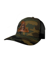 The Alex Jones Store - Angled side view of camo America Supply Co Gadsden leather patch trucker hat with rattlesnake patch and black mesh back