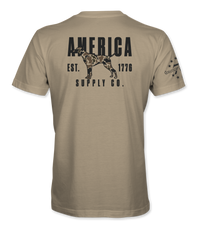 The Alex Jones Store - Back of tan America Supply Co Hunting Dog t-shirt with black camo-filled pointer dog and Est. 1776 banner print