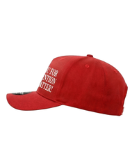 The Alex Jones Store - Thank You For Your Attention To This Matter Trucker Hat — Red trucker hat right side view showing curved brim and partial 'Attention To This Matter' embroidery on side panel