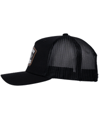 The Alex Jones Store - Support Your Local ICE Raid Trucker Patch Hat — Black trucker patch hat left side view with mesh back panels and partial ICE Raids leather patch visible