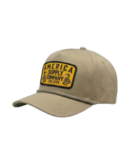 The Alex Jones Store - Side angle of tan America Supply Company patch hat showing yellow rattlesnake patch and braided rope detail across crown