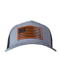 The Alex Jones Store - Heather grey American Flag leather patch trucker hat with Betsy Ross 13-star flag patch and black mesh back