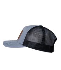 The Alex Jones Store - Heather grey and black trucker hat, left side view, with American flag leather patch on front, Betsy Ross flag style