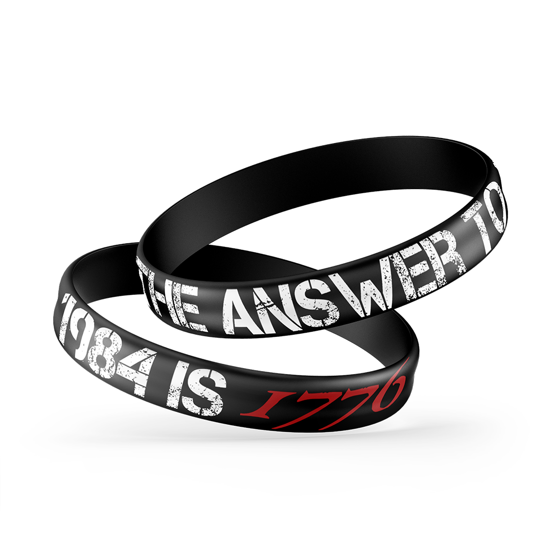 The Alex Jones Store - Black silicone wristbands stacked, white and red 'The Answer To 1984 Is 1776' Alex Jones design