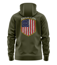 The Alex Jones Store - Olive green American 1776 hoodie back view with Betsy Ross flag shield graphic and 'American 1776' banner