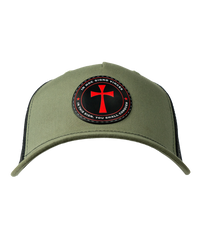 The Alex Jones Store - Front of olive green trucker hat with circular patch showing red cross and 'In Hoc Signo Vinces - In This Sign You Shall Conquer'