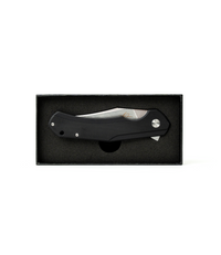 The Alex Jones Store - Alex Jones Phantom folding blade displayed inside premium black foam-lined gift box, closed position with black G10 handle