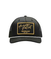 The Alex Jones Store - Front of black American Patriot Shooting Club hat with gold-bordered stitched patch, white rope and black mesh back