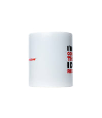 The Alex Jones Store - "I Do My Research" Limited Edition Coffee Mug — Side view of white I Do My Research ceramic mug showing partial slogan text and store URL wrapping around the cup