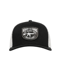 The Alex Jones Store - Front of black and white Nobody Is Coming To Save You trucker hat with stitched Molon Labe rifle patch on black front panel and white mesh back