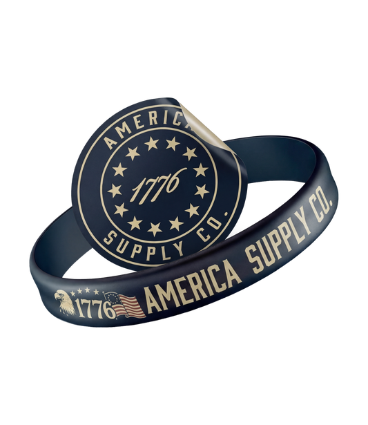 The Alex Jones Store - America Supply Co. Wristband + Decal Bundle — Navy blue America Supply Co. silicone wristband with gold 1776 Betsy Ross seal and embossed eagle flag detail